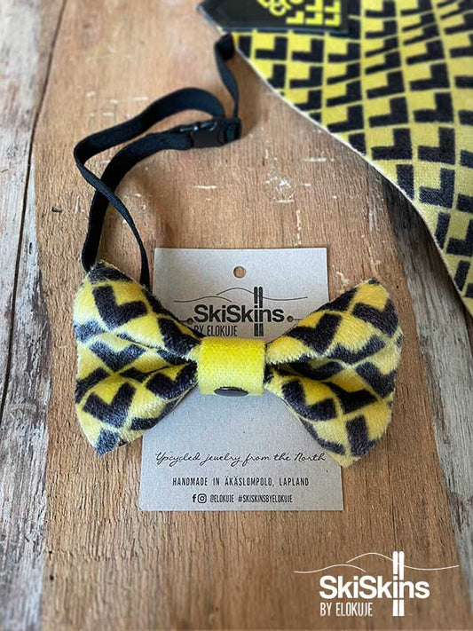 Black Crows -nousukarvasta eli skinistä käsin valmistettu keltamusta rusetti miehelle