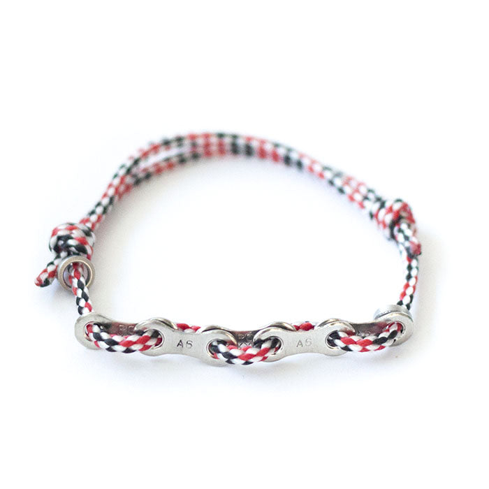 Remankeli cord bracelet with bicycle chain links